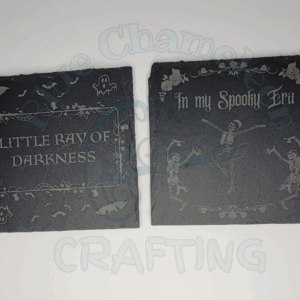 Copy of COMIC_20250902_102642_0000 Custom laser engraved stone coaster with spooky design on tabletop.